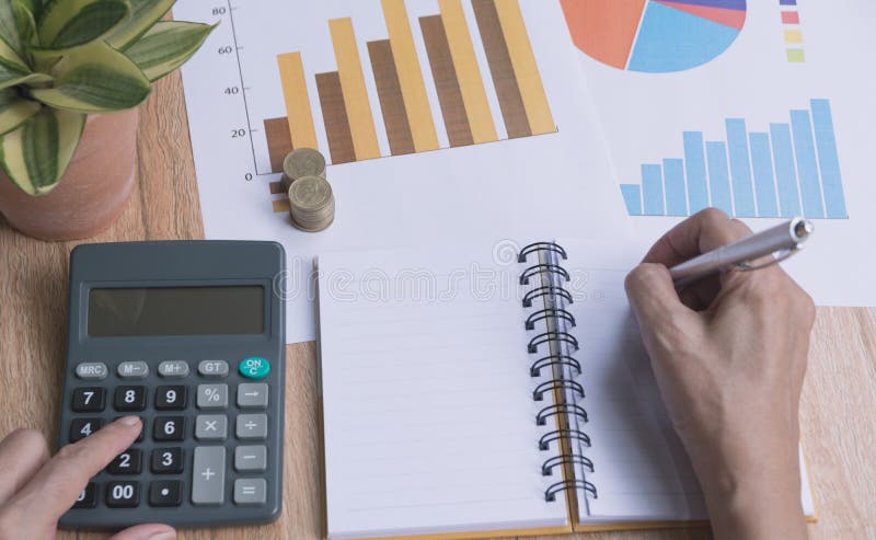 Businessman working and using a calculator for financial and accounting concept.