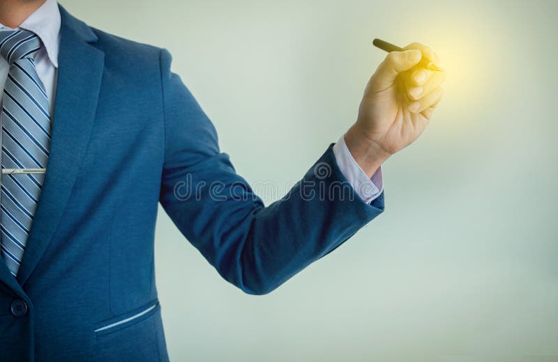 Businessman writing, drawing on the blank screen with copy space royalty free stock photos Businessman writing, drawing on the blank screen with copy space royalty free stock photos