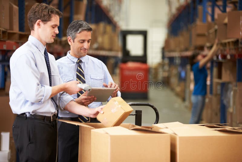 Businessmen Checking Boxes With Digital Tablet And Scanner royalty free stock photography Businessmen Checking Boxes With Digital Tablet And Scanner royalty free stock photography