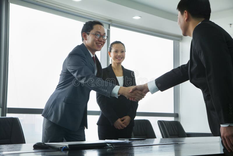 Businessmen Greeting Each Other with a Handshake stock image