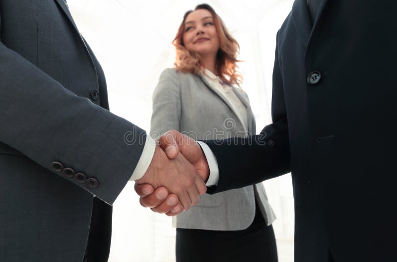 Close up business man handshake together on meeting room