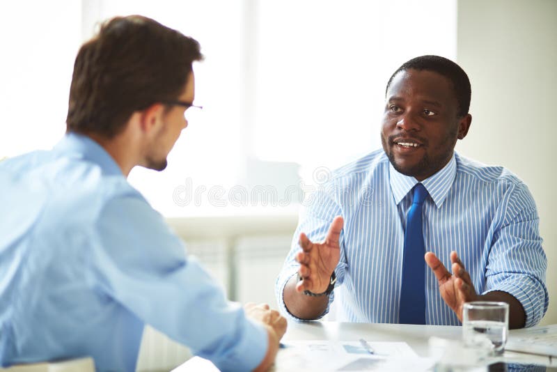 Businessmen talking stock photos