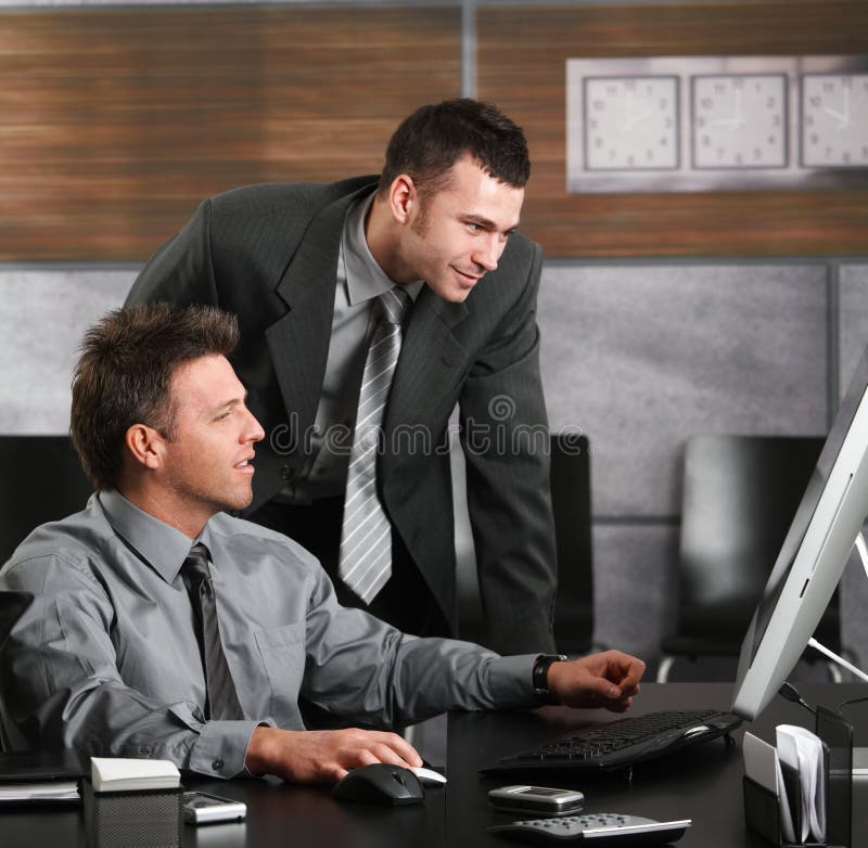 Businessmen working with computer