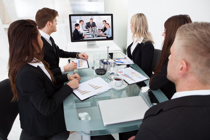 Businesspeople attending video conference royalty free stock images