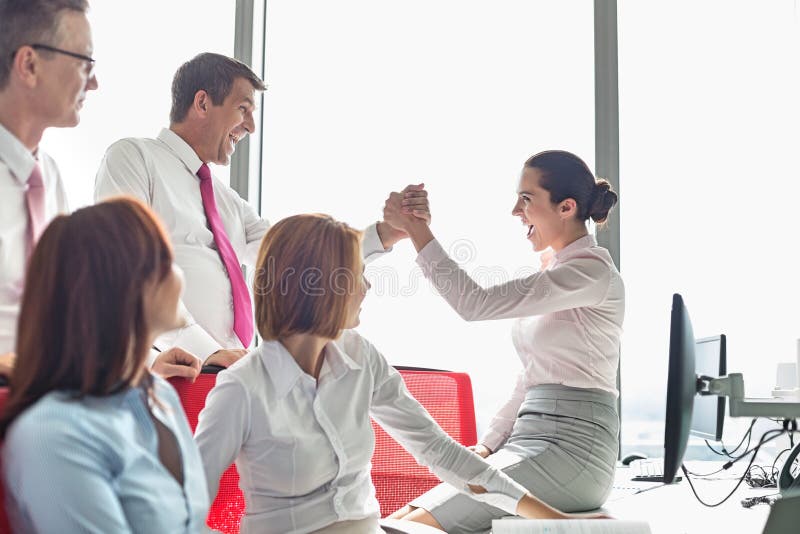 Businesspeople Celebrating Success in Office Stock Image Image of