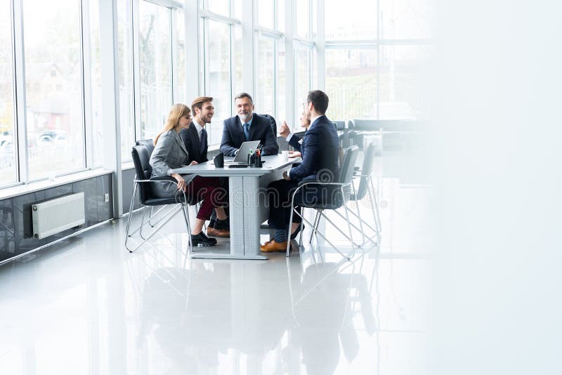 Businesspeople discussing together in conference room during meeting at office. stock image Businesspeople discussing together in conference room during meeting at office. stock image