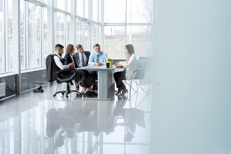 Businesspeople discussing together in conference room during meeting at office. royalty free stock images Businesspeople discussing together in conference room during meeting at office. royalty free stock images