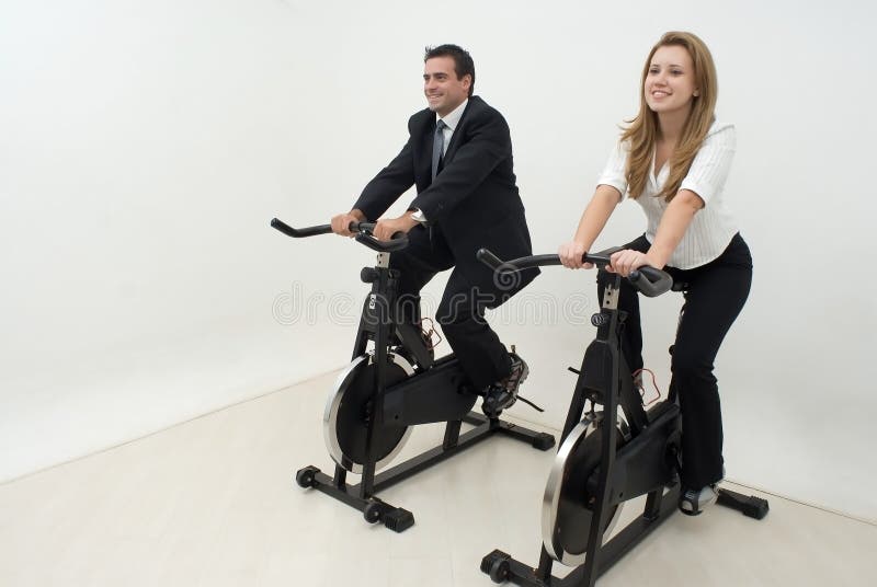 Businesspeople on Exercise Bikes - Horizontal