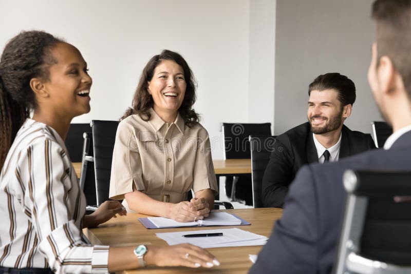 Businesspeople laughing, joking enjoy friendly collaborative atmosphere during meeting royalty free stock photos