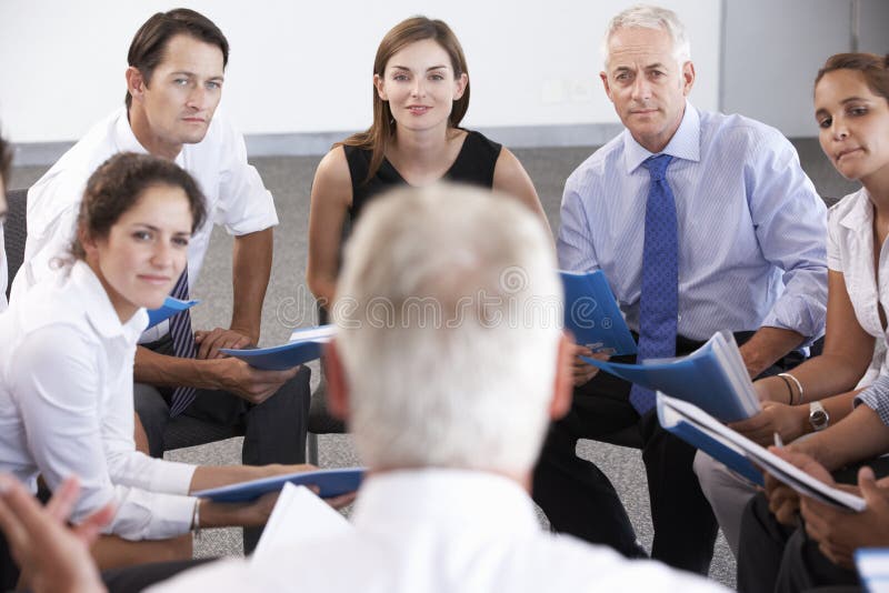 Businesspeople Seated In Circle At Company Seminar stock photography Businesspeople Seated In Circle At Company Seminar stock photography