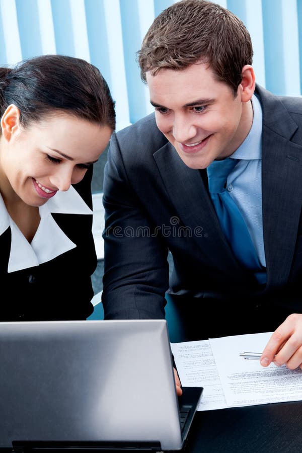 Two businesspeople working with laptop