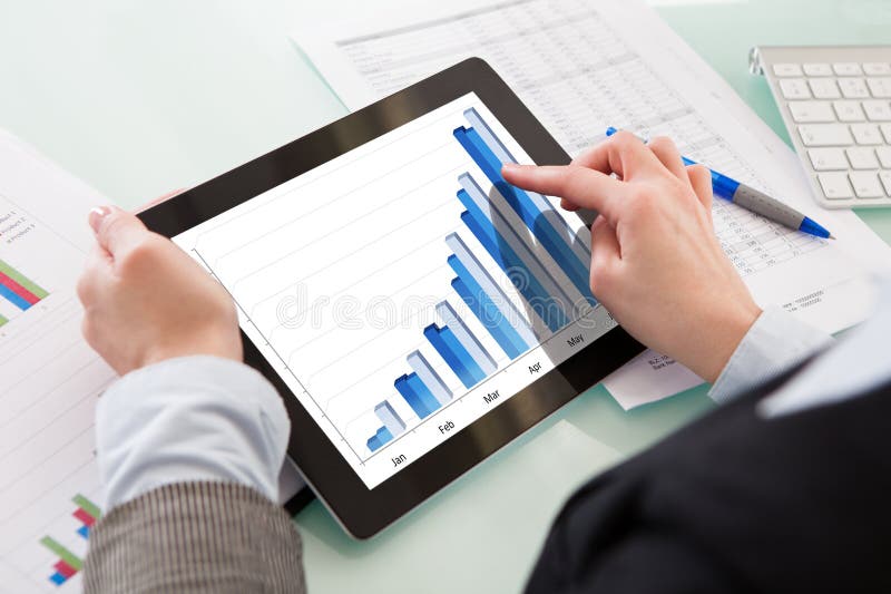 Close-up Of Hands Holding Digital Tablet stock image