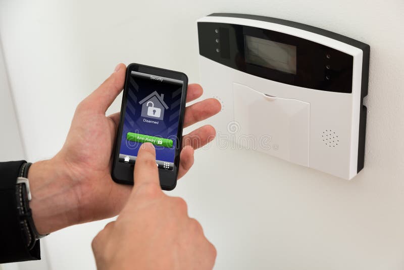 Businessperson Arming Security System stock photography