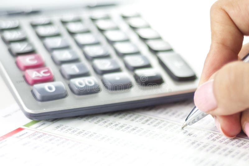Businesswoman balancing the accounts stock images