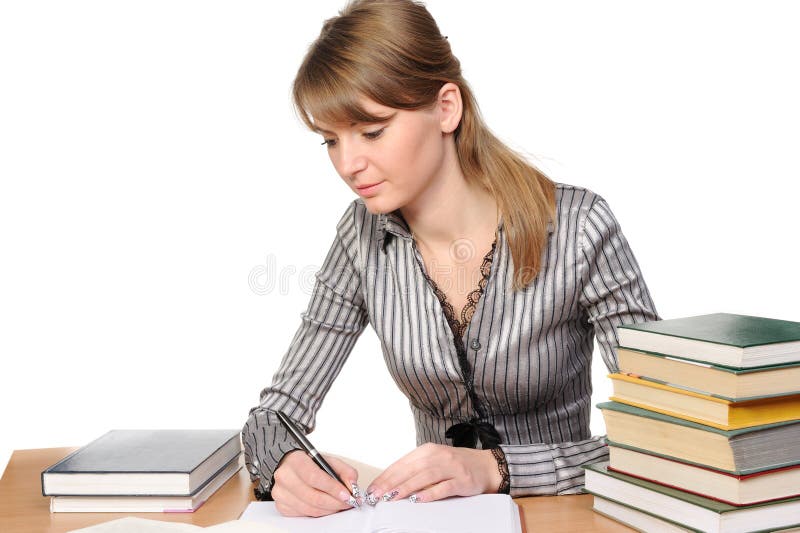 Businesswoman with books on table