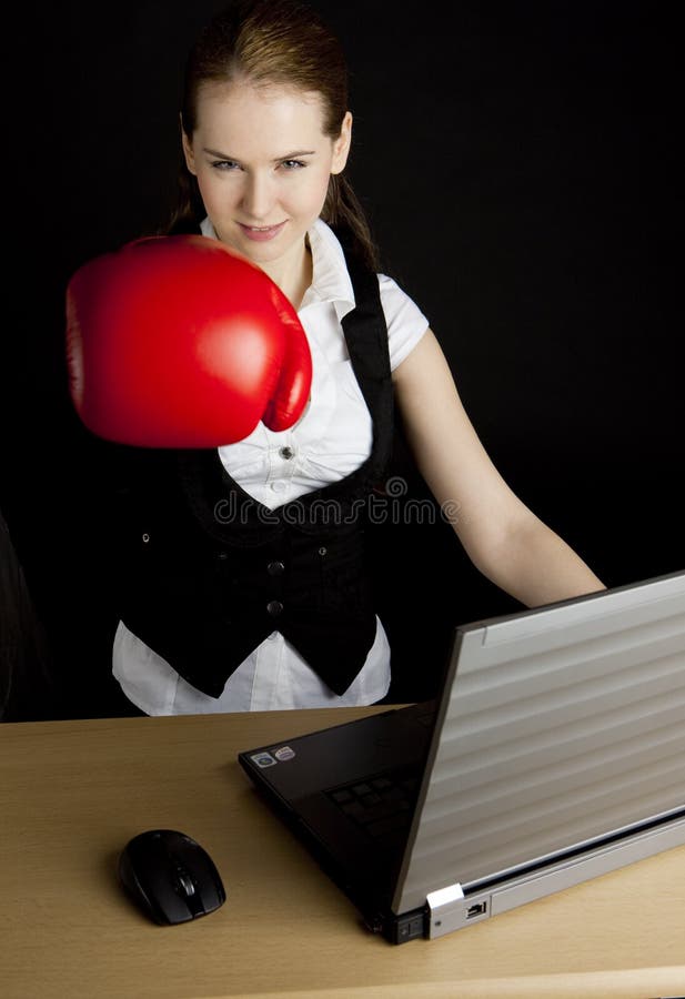 Businesswoman with boxing glove