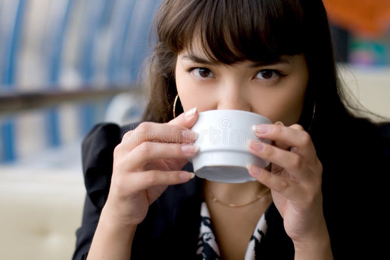 Businesswoman drinking tea