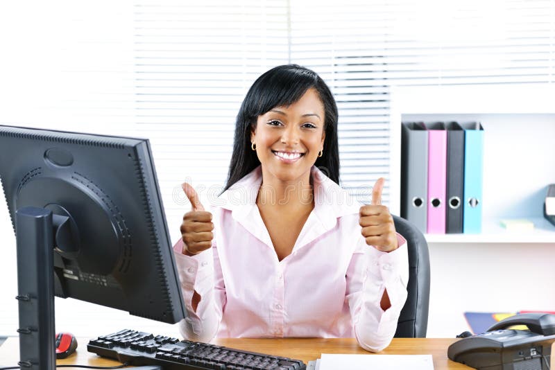 Businesswoman giving thumbs up stock photo Businesswoman giving thumbs up stock photo
