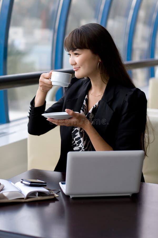 Businesswoman having a cup of tea