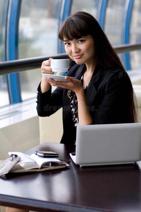 Businesswoman having a cup of tea