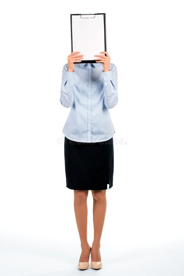 Businesswoman hiding face behind clipboard. royalty free stock photography Businesswoman hiding face behind clipboard. royalty free stock photography