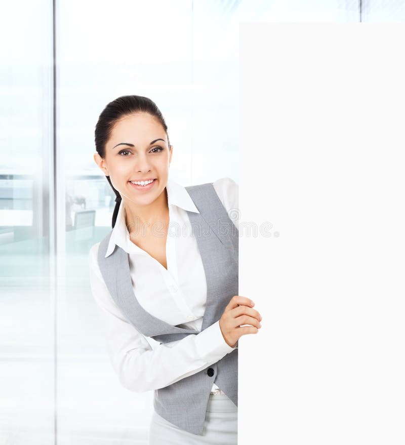 Businesswoman holding a blank white card board royalty free stock photo Businesswoman holding a blank white card board royalty free stock photo
