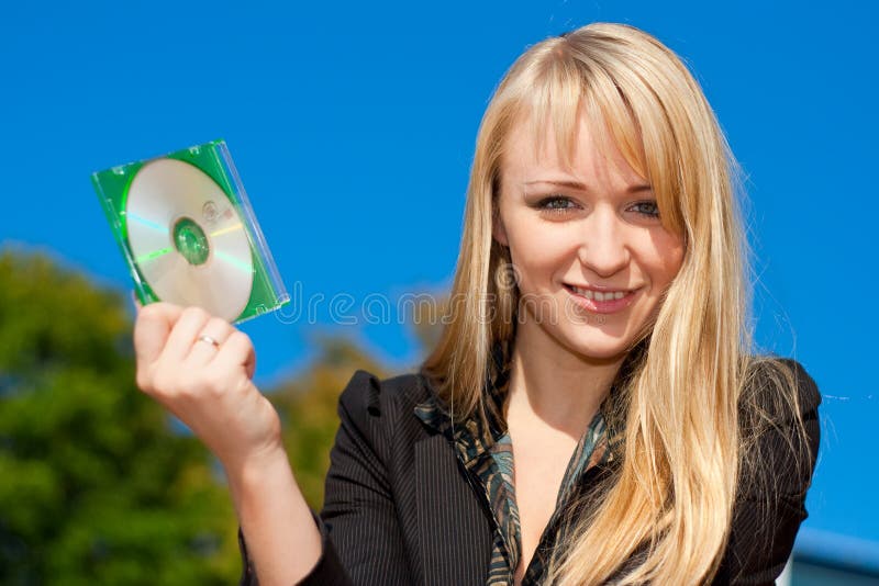 Businesswoman holding CD