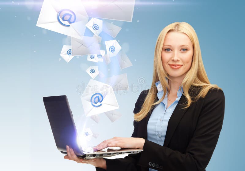 Businesswoman holding laptop with email sign