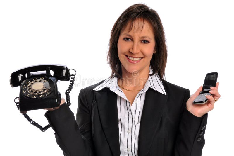 Businesswoman holding a vintage phone and a cell