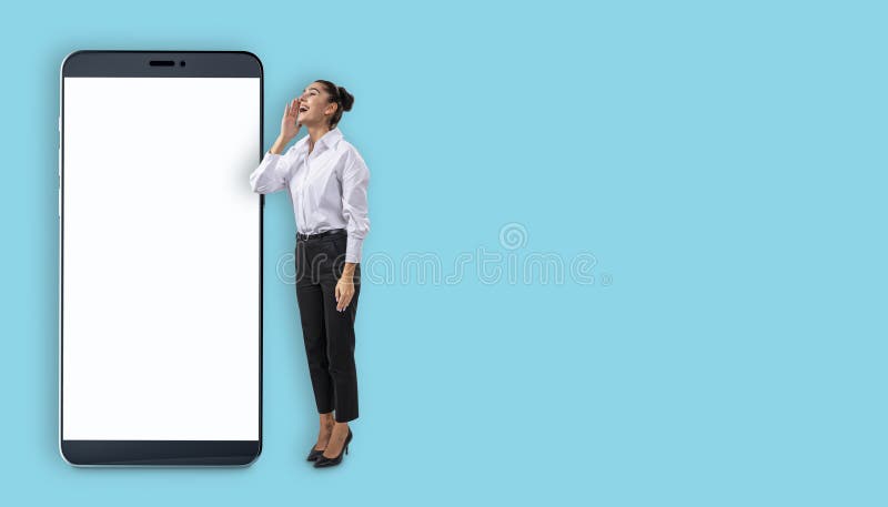 Businesswoman interacting with a giant smartphone mockup on a light blue background. Concept for technology, online services, and royalty free stock photo
