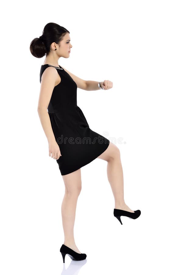 Businesswoman kicking royalty free stock image