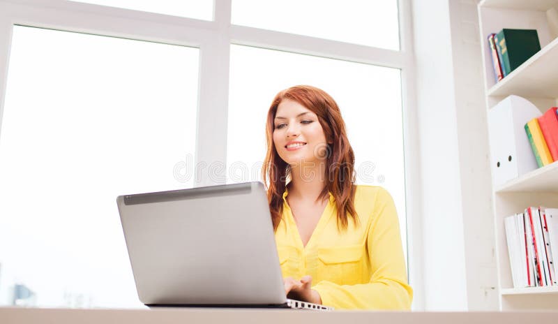 Businesswoman with laptop computer in office