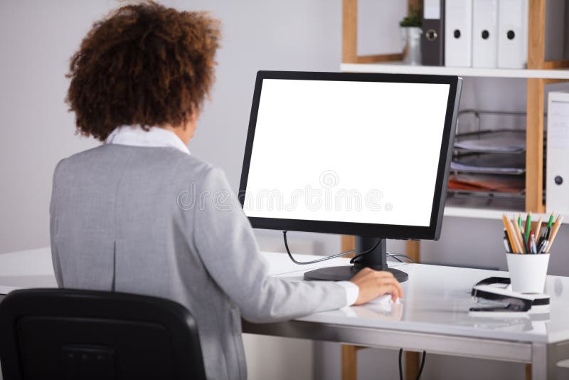 Businesswoman Looking At Blank Computer Screen stock photos