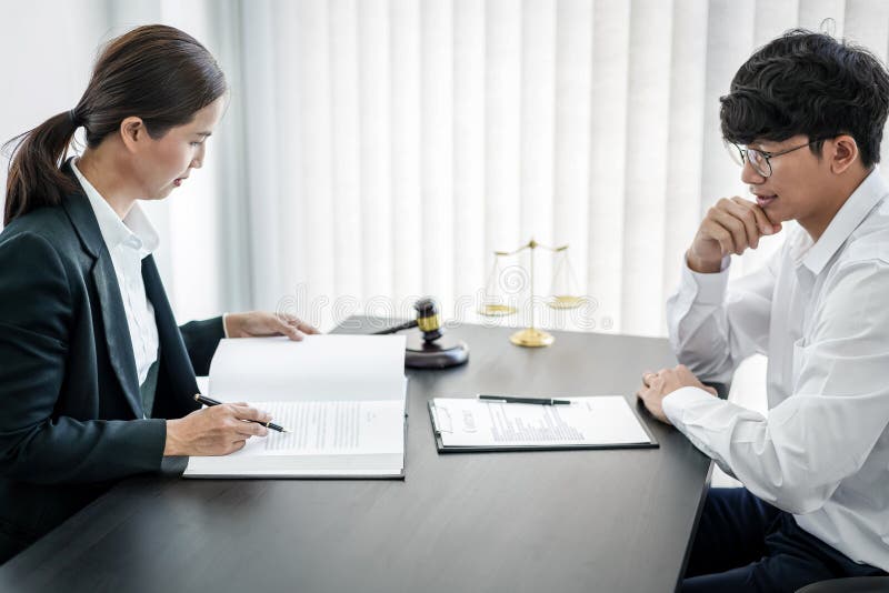 Businesswoman and Male lawyer or judge consult and conference having team meeting with client at law firm in office, Law and Legal stock photos