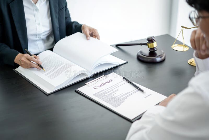 Businesswoman and Male lawyer or judge consult and conference having team meeting with client at law firm in office, Law and Legal stock photography