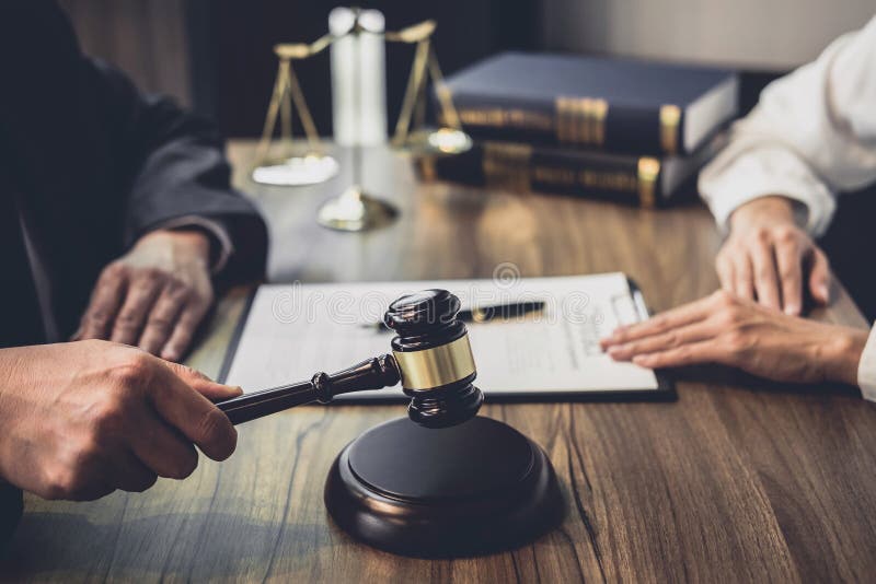 Businesswoman and Male lawyer or judge consult having team meeting with client, Law and Legal services concept royalty free stock image Businesswoman and Male lawyer or judge consult having team meeting with client, Law and Legal services concept royalty free stock image