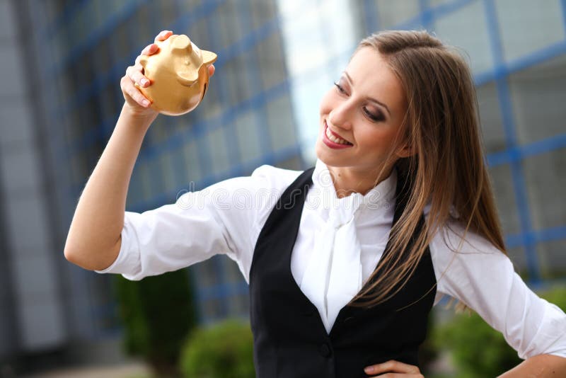 Businesswoman with moneybox