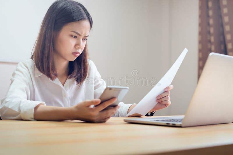 Businesswoman in office and use computer to perform financial accounting. royalty free stock photography Businesswoman in office and use computer to perform financial accounting. royalty free stock photography