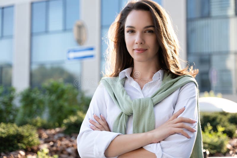 Businesswoman portrait. Caucasian female business person standing outdoor looking at camera stock images Businesswoman portrait. Caucasian female business person standing outdoor looking at camera stock images