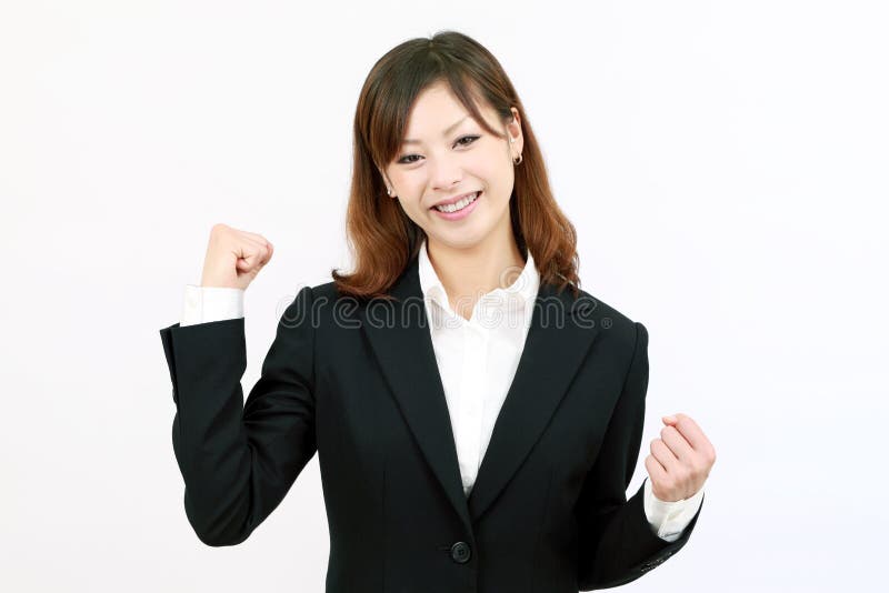 Businesswoman raising her arms in sign of victory