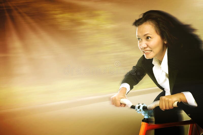 Businesswoman In A Rush Riding A Bicycle To Work