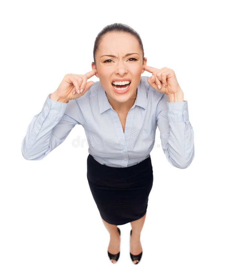 Businesswoman screaming with closed ears royalty free stock image Businesswoman screaming with closed ears royalty free stock image