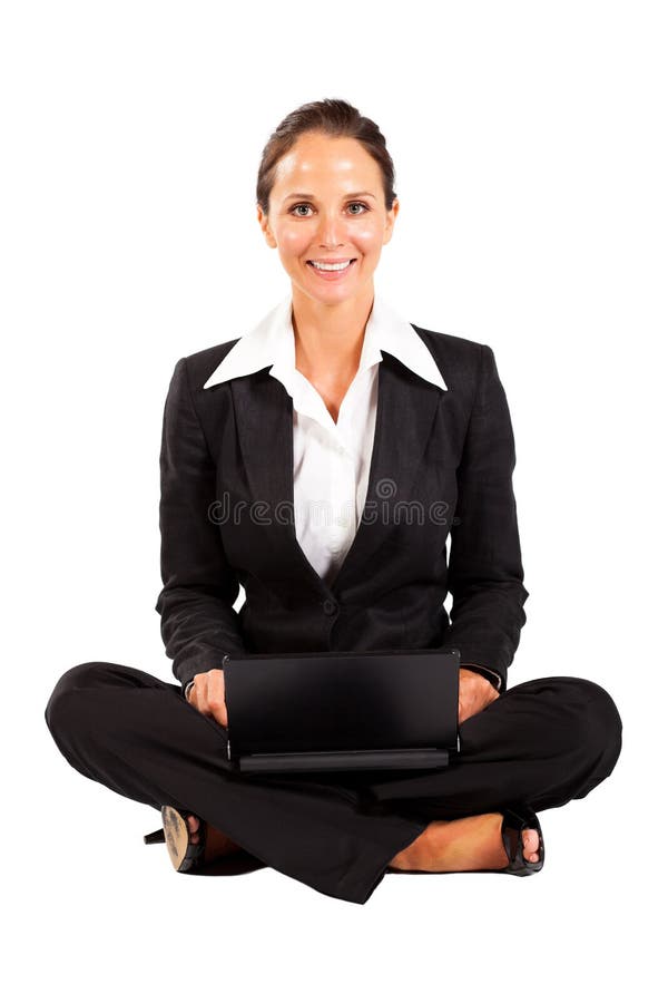 Businesswoman sitting on floor with laptop