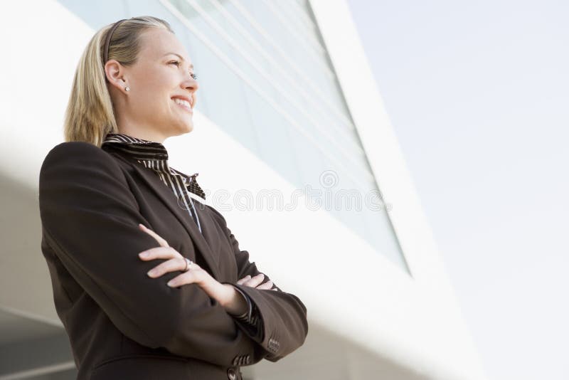 Businesswoman standing outdoors by building royalty free stock photos Businesswoman standing outdoors by building royalty free stock photos