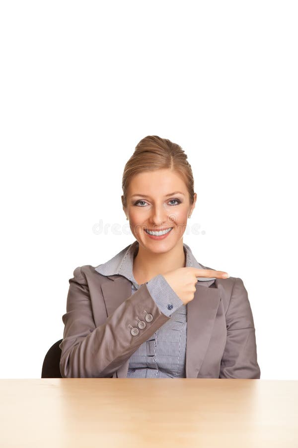 Businesswoman in suit pointing hand