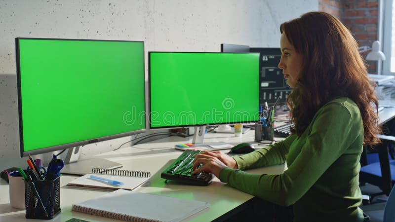 Businesswoman texting mockup pc at work desk closeup. Lady watching two displays stock photos