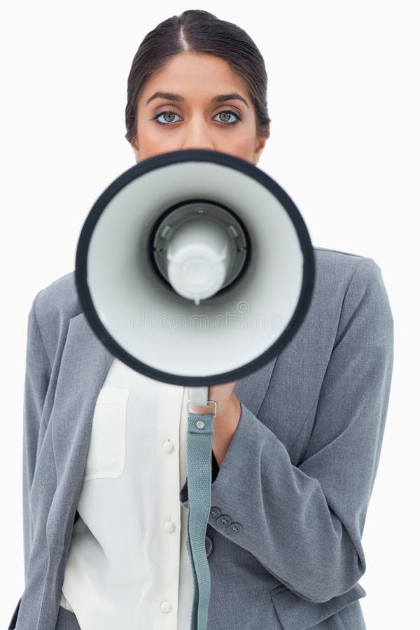 Businesswoman using megaphone against a white background