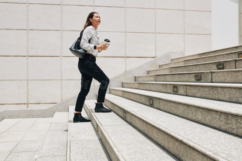 Businesswoman Hurrying To Work Stock Image - Image of woman, stairs ...
