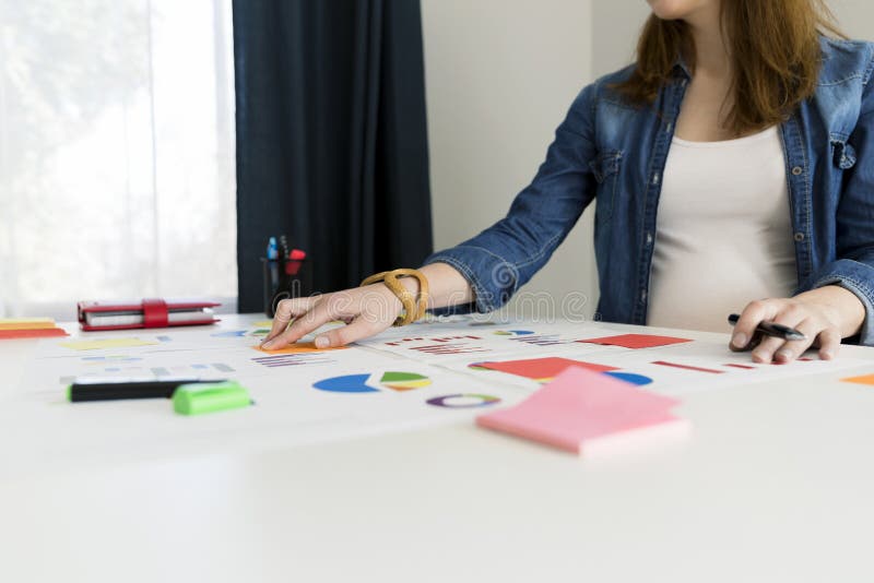 Businesswoman working with graphs and charts. Business concept, royalty free stock photography Businesswoman working with graphs and charts. Business concept, royalty free stock photography