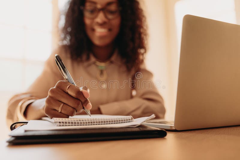 Businesswoman working from home on laptop stock images Businesswoman working from home on laptop stock images